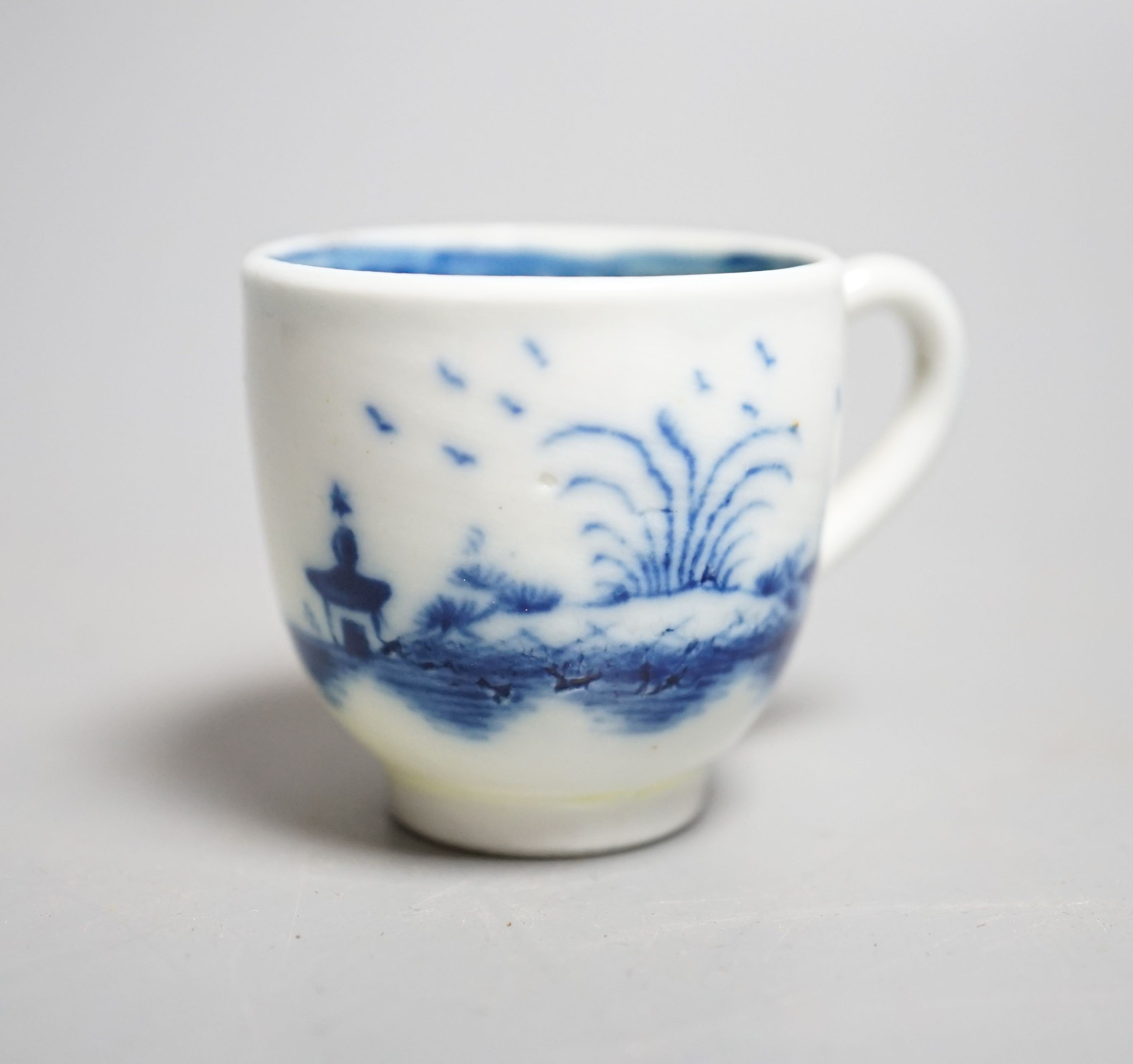 A Caughley 'The Island pattern' blue and white miniature cup, c.1780, 3.4cm. Provenance - Mona Sattin collection of miniature cups and saucers, collection no.16.